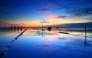 Sunset reflecting sky clouds beach - a sunset free wallpaper