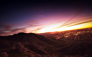 City hillset sunset clouds beach - a view of a city free wallpaper