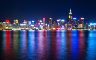 City skyline night reflections boat 4 - the water and a boat free wallpaper
