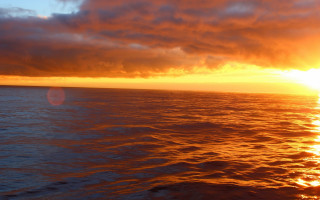 Sunset ocean boat clouds hudson 2 - a sunset over the ocean free wallpaper
