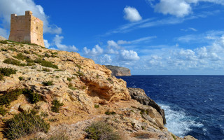 Rocky cliff tower ocean sky - daphne fedarb free wallpaper