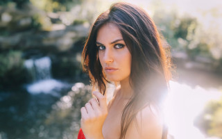 Woman red dress waterfall portrait - a waterfall behind her free wallpaper