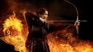 Woman archer fire background flames - a bow and arrow in front free wallpaper