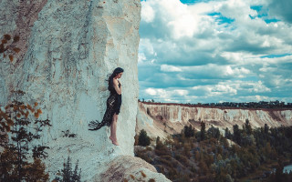 Woman rock ledge mountains sky - elinor proby adams free wallpaper