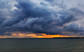Boat water sunset cloudy sky 3 - stormy weather free wallpaper