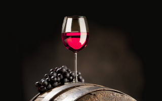 Wine glass on barrel grapes - grape free wallpaper