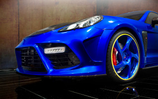 Blue sports car yellow rims 2 - vibrant colour free wallpaper