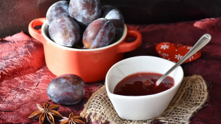 Plums bowl table cloth spoon - a still life free wallpaper