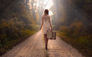 Woman walking dirt road suitcase 2 - cinematic free wallpaper for desktop