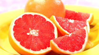 Grapefruit yellow plate blue background - a white stripe free wallpaper