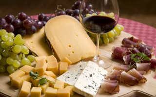 Wooden plate cheese grapes wine - a wine glass free wallpaper