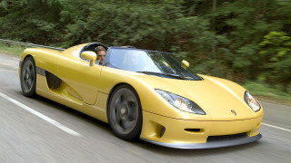 Yellow sports car driving forest 4 - a forest of trees and bushes free wallpaper