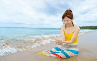 Woman beach smile towel ocean - the ocean in the background free wallpaper