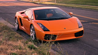 Orange sports car parked roadside - orange free wallpaper