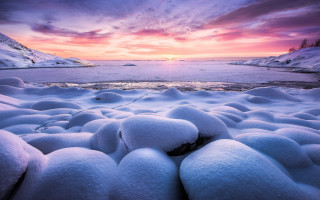 Sunset frozen lake snow rocks - a sunset over a free wallpaper