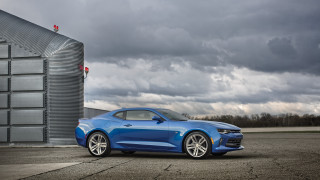 Blue car building cloudy sky - a blue car free wallpaper