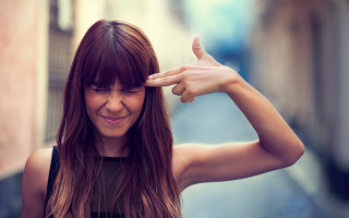 Woman smiling longhair handgesture street - a narrow street free wallpaper