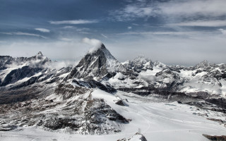 Snowy mountains cloudy sky lake - mountain in the background free wallpaper