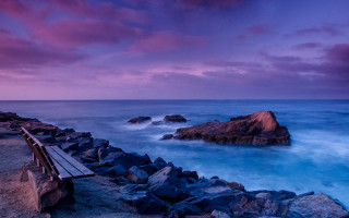Rocky beach sunset purple sky - a purple sky free wallpaper
