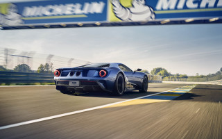 Blue sports car race track - a banner in the background free wallpaper