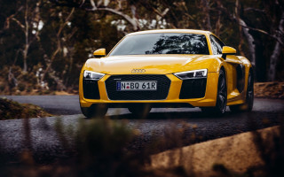 Yellow sports car country road - cloudy free wallpaper