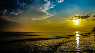 Lighthouse beach sunset clouds cityscape - a matte painting free wallpaper for desktop