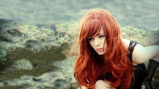 Red haired woman posing field - a picture in a field of grass free wallpaper