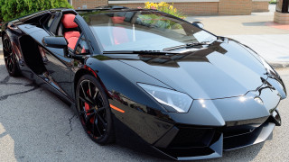 Black sports car red seat - the side of the road free wallpaper