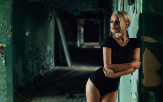 Woman black bodysuit green wall - paint free wallpaper