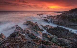 Rocky beach red sunset matte - rich moody colour free wallpaper