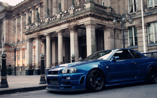 Blue car building clock tower - a stone building free wallpaper