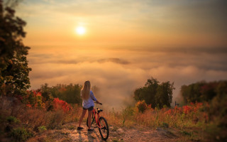 Mountain woman bike clouds autumn - alena aenami free wallpaper
