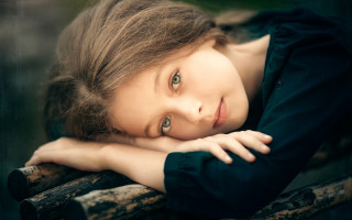 Young girl leaning on rail - young free wallpaper