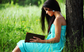 Woman blue dress sitting grass - a book in her hands free wallpaper