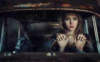 Woman car window serious blue - anka zhuravleva free wallpaper