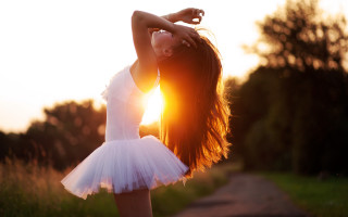 Girl white dress handstand sunset - her arm behind her head free wallpaper