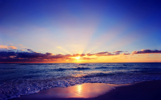 Sunset ocean beach waves clouds - a picture free wallpaper