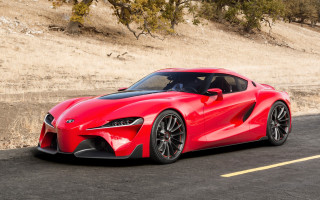 Red sports car road hillside - a yellow line free wallpaper