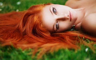 Red haired woman lying grass - field free wallpaper for desktop