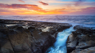 Sunset rocky beach waterfall ocean 2 - over the water free wallpaper