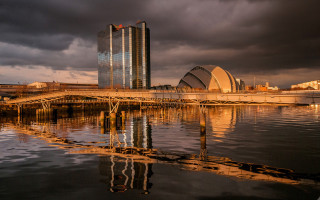 Bridge water building clouds cityscape - a bridge over a body of water free wallpaper