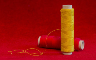 Spool thread red background triadic - a cross stitch free wallpaper