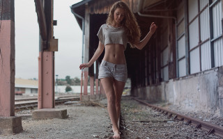 Woman shorts shirt traintrack city - half body free wallpaper