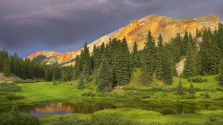 Mountain lake forest sky bridge 4 - a dark sky in the background free wallpaper