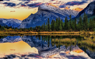 Mountain lake trees sunset clouds 7 - the foreground and a sunset in the background free wallpaper