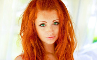 Red hair green eyes portrait 2 - a white curtain behind her free wallpaper