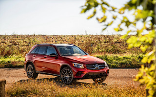 Red mercedes suv dirt road - side profile free wallpaper