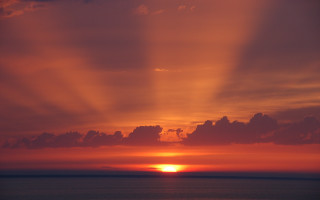 Sunset clouds plane water sky - a sunset free wallpaper