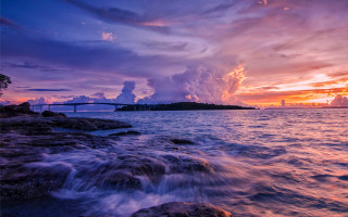 Sunset water bridge clouds cityscape - colorful cloud free wallpaper