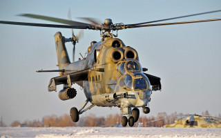 Helicopter snowyfield trees blue sky - low free wallpaper